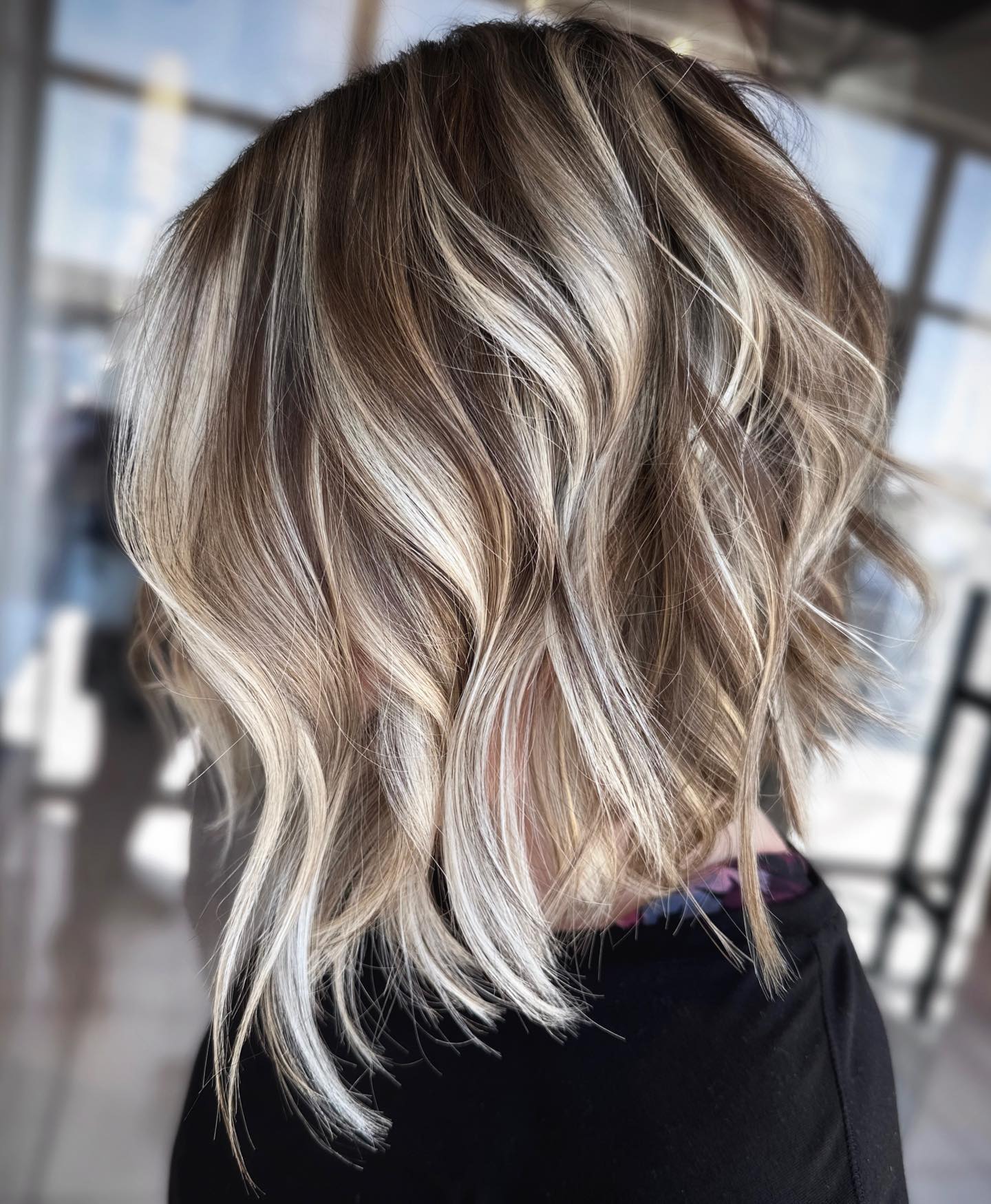 Highlighted Angled Bob for Wavy Hair