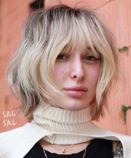 Shaggy Bob with Bangs and Platinum Blonde Highlights