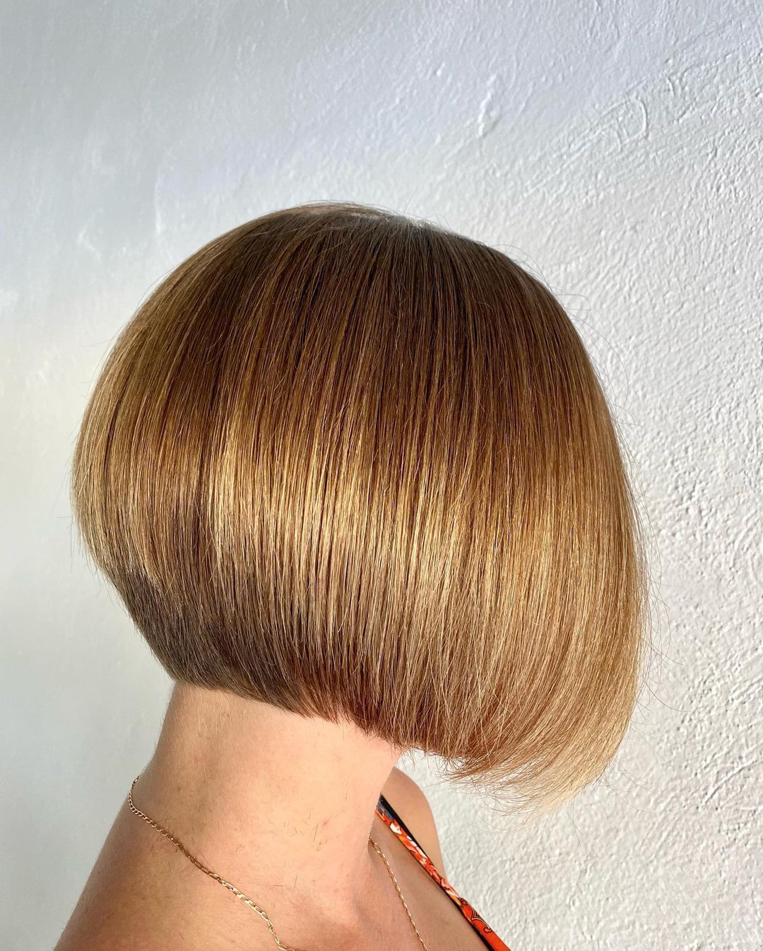 Sleek Honey Blonde Bob Cut